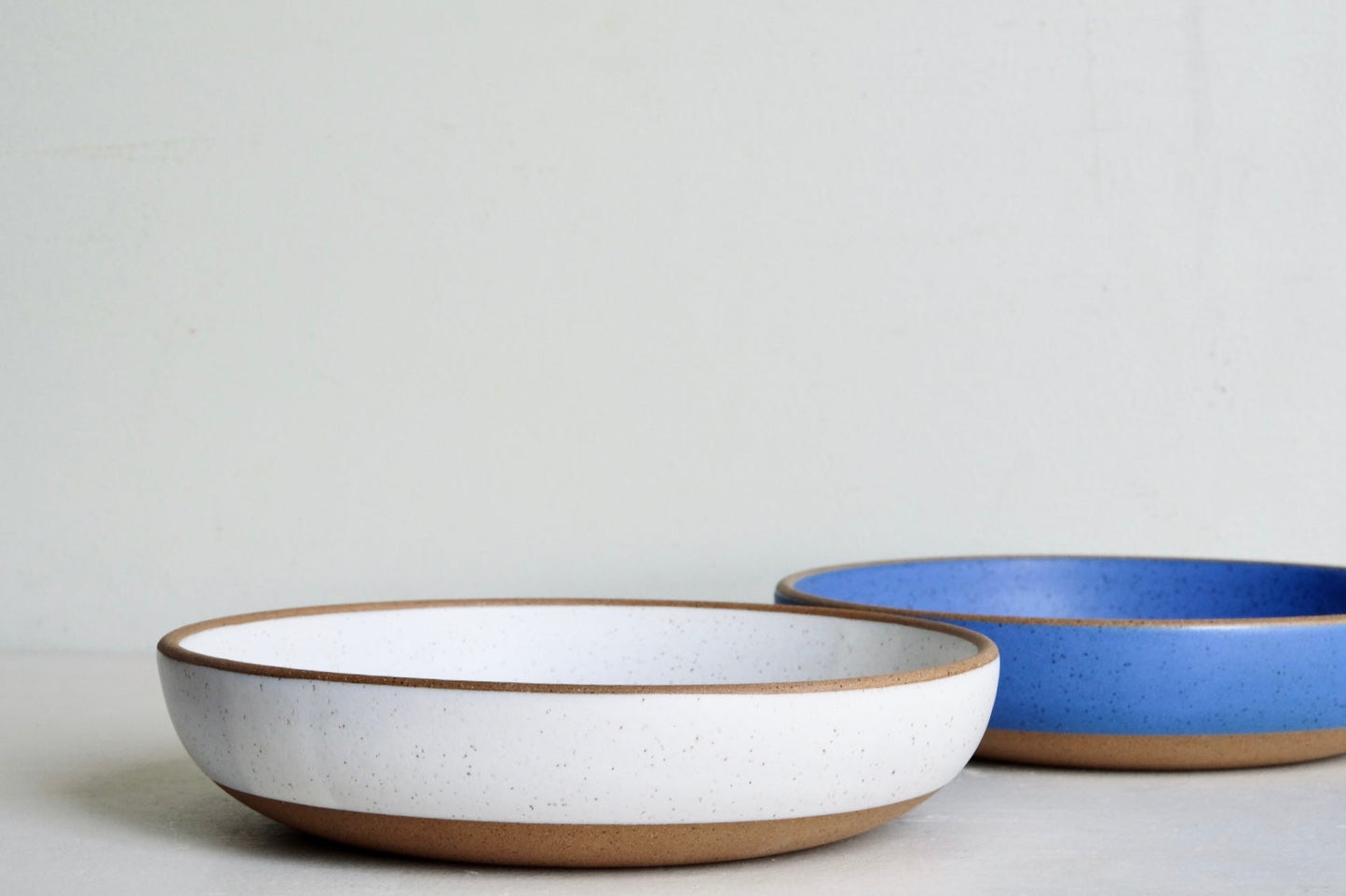 A medium serving dish that's dipped fully in a blue sky-blue glaze.