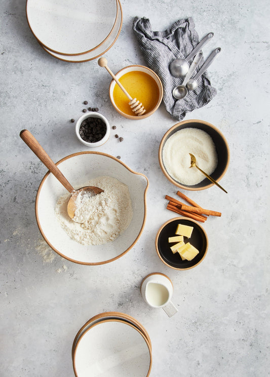 A wide lipped bowl with a spout for easy pouring.